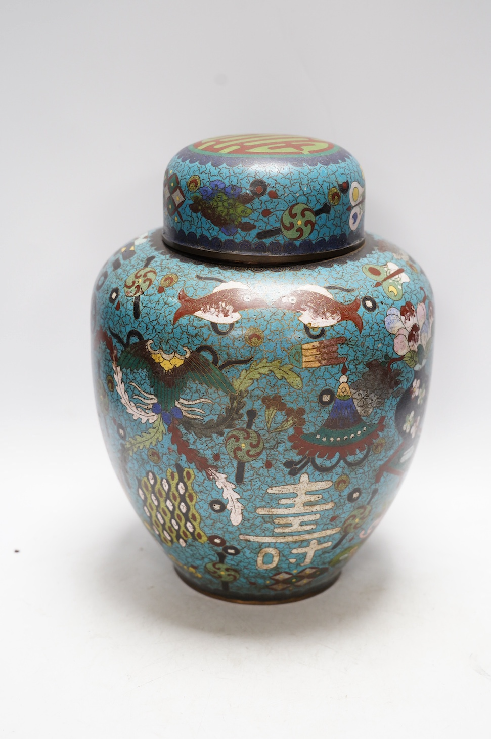 A Chinese cloisonné enamel jar and cover, early 20th century, 30cm high. Condition - poor